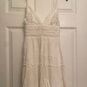 White thick cotton material with low back.